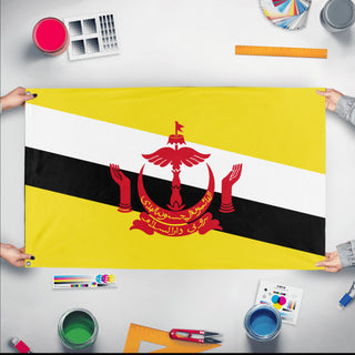 A mockup of the custom flag 'Flag of Brunei flag' held up on a table during print checking