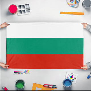 A mockup of the custom flag 'Flag of Bulgaria flag' held up on a table during print checking