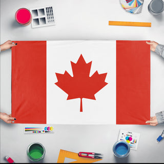 A mockup of the custom flag 'Flag of Canada flag' held up on a table during print checking