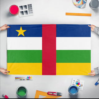 A mockup of the custom flag 'Flag of Central African Republic flag' held up on a table during print checking