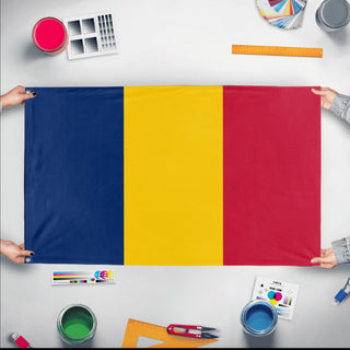 A mockup of the custom flag 'Flag of Chad flag' held up on a table during print checking