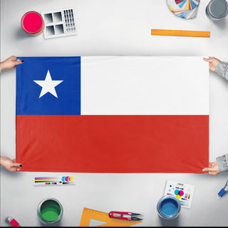 A mockup of the custom flag 'Flag of Chile flag' held up on a table during print checking