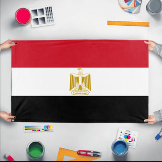A mockup of the custom flag 'Flag of Egypt flag' held up on a table during print checking