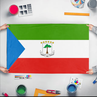 A mockup of the custom flag 'Flag of Equatorial Guinea flag' held up on a table during print checking