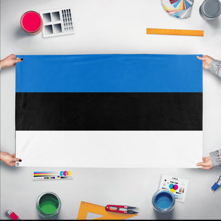 A mockup of the custom flag 'Flag of Estonia flag' held up on a table during print checking