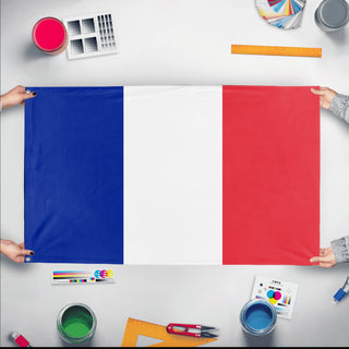 A mockup of the custom flag 'Flag of France flag' held up on a table during print checking