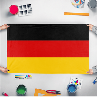 A mockup of the custom flag 'Flag of Germany flag' held up on a table during print checking