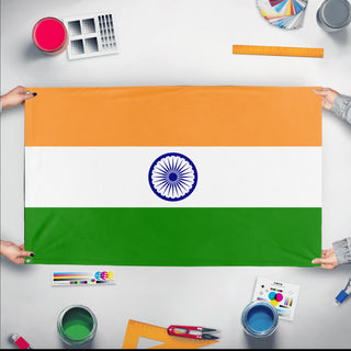 A mockup of the custom flag 'Flag of India flag' held up on a table during print checking