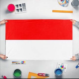 A mockup of the custom flag 'Flag of Indonesia flag' held up on a table during print checking