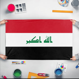 A mockup of the custom flag 'Flag of Iraq flag' held up on a table during print checking