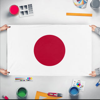 A mockup of the custom flag 'Flag of Japan flag' held up on a table during print checking