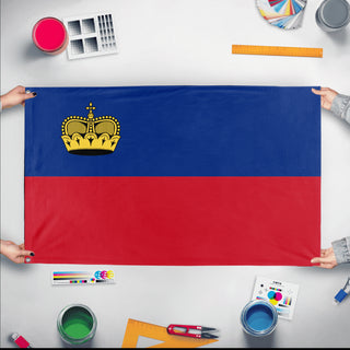A mockup of the custom flag 'Flag of Liechtenstein flag' held up on a table during print checking