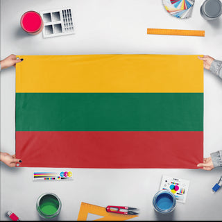 A mockup of the custom flag 'Flag of Lithuania flag' held up on a table during print checking