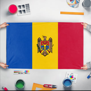 A mockup of the custom flag 'Flag of Moldova flag' held up on a table during print checking