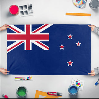 A mockup of the custom flag 'Flag of New Zealand flag' held up on a table during print checking