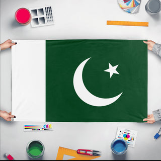 A mockup of the custom flag 'Flag of Pakistan flag' held up on a table during print checking