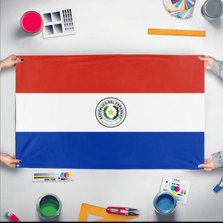 A mockup of the custom flag 'Flag of Paraguay flag' held up on a table during print checking