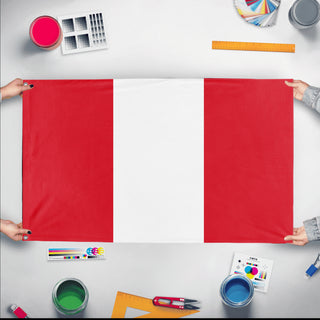 A mockup of the custom flag 'Flag of Peru flag' held up on a table during print checking
