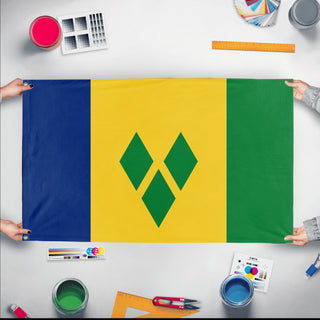 A mockup of the custom flag 'Flag of Saint Vincent and the Grenadines flag' held up on a table during print checking
