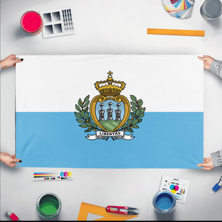 A mockup of the custom flag 'Flag of San Marino flag' held up on a table during print checking