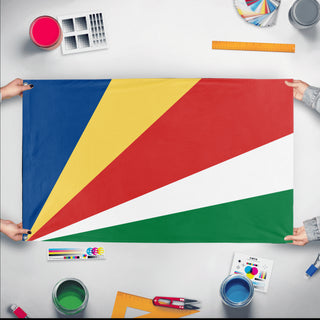 A mockup of the custom flag 'Flag of Seychelles flag' held up on a table during print checking