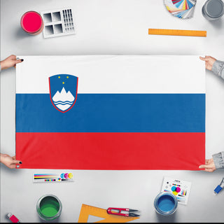 A mockup of the custom flag 'Flag of Slovenia flag' held up on a table during print checking