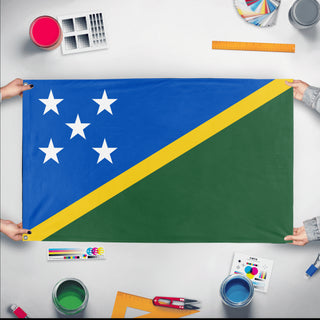 A mockup of the custom flag 'Flag of Solomon Islands flag' held up on a table during print checking