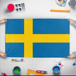 A mockup of the custom flag 'Flag of Sweden flag' held up on a table during print checking