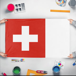 A mockup of the custom flag 'Flag of Switzerland flag' held up on a table during print checking