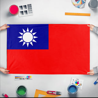 A mockup of the custom flag 'Flag of Taiwan flag' held up on a table during print checking