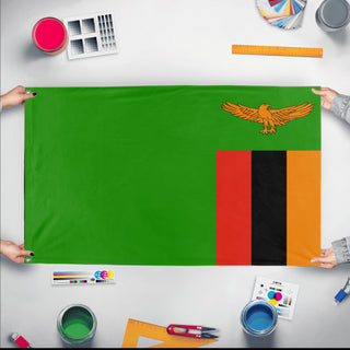 A mockup of the custom flag 'Flag of Zambia flag' held up on a table during print checking