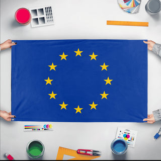 A mockup of the custom flag 'EU Flag' held up on a table during print checking