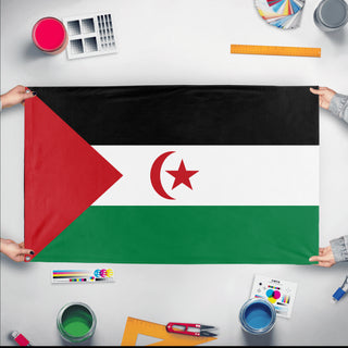 A mockup of the custom flag 'Western Sahara Flag' held up on a table during print checking