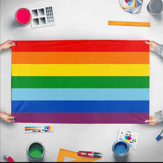 A mockup of the custom flag 'Quechuas of Bolivia and Peru Flag' held up on a table during print checking