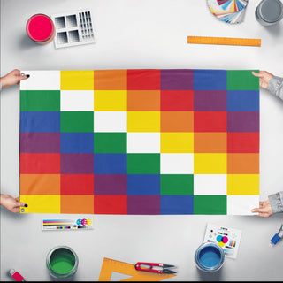 A mockup of the custom flag 'Indigenous People of South America Flag' held up on a table during print checking