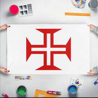 A mockup of the custom flag 'Portuguese Order of Christ Flag' held up on a table during print checking