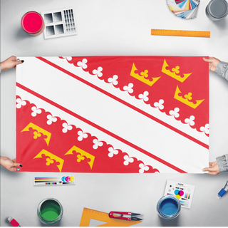 A mockup of the custom flag 'Alsace Flag' held up on a table during print checking