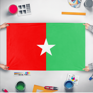 A mockup of the custom flag 'Somalia Jubaland Indepence Flag' held up on a table during print checking
