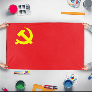 A mockup of the custom flag 'Chinese Communist Party Flag' held up on a table during print checking