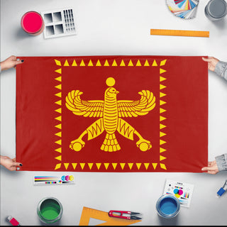 A mockup of the custom flag 'Flag of Cyrus The Great flag' held up on a table during print checking