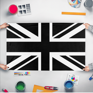 A mockup of the custom flag 'Black United Kingdom Flag' held up on a table during print checking