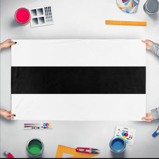 A mockup of the custom flag 'Delft Flag' held up on a table during print checking