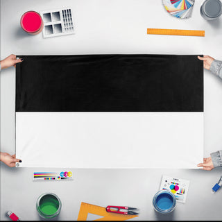 A mockup of the custom flag 'Ulm Flag' held up on a table during print checking