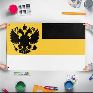 A mockup of the custom flag 'Russian Empire 1858 Eagle Flag' held up on a table during print checking
