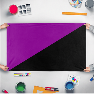 A mockup of the custom flag 'Anarcho-feminism Flag' held up on a table during print checking
