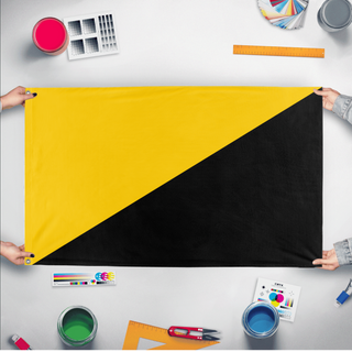 A mockup of the custom flag 'Capitalist Flag' held up on a table during print checking