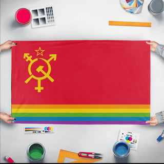A mockup of the custom flag 'Luxury Gay Space Communism Flag' held up on a table during print checking
