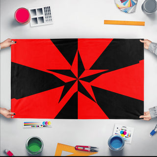 A mockup of the custom flag 'Libertarian Socialist Flag' held up on a table during print checking