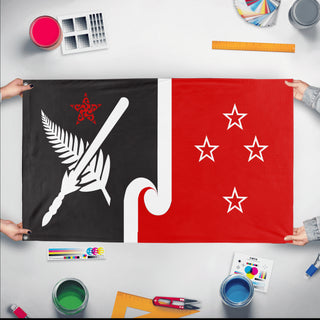 A mockup of the custom flag 'Socialist New Zealand Flag' held up on a table during print checking