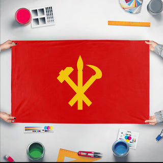 A mockup of the custom flag 'Socialist North Korea Flag' held up on a table during print checking